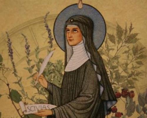 Hildegard van Bingen. Prent van Hildegard van Bingen. Ze schrijft een brief.